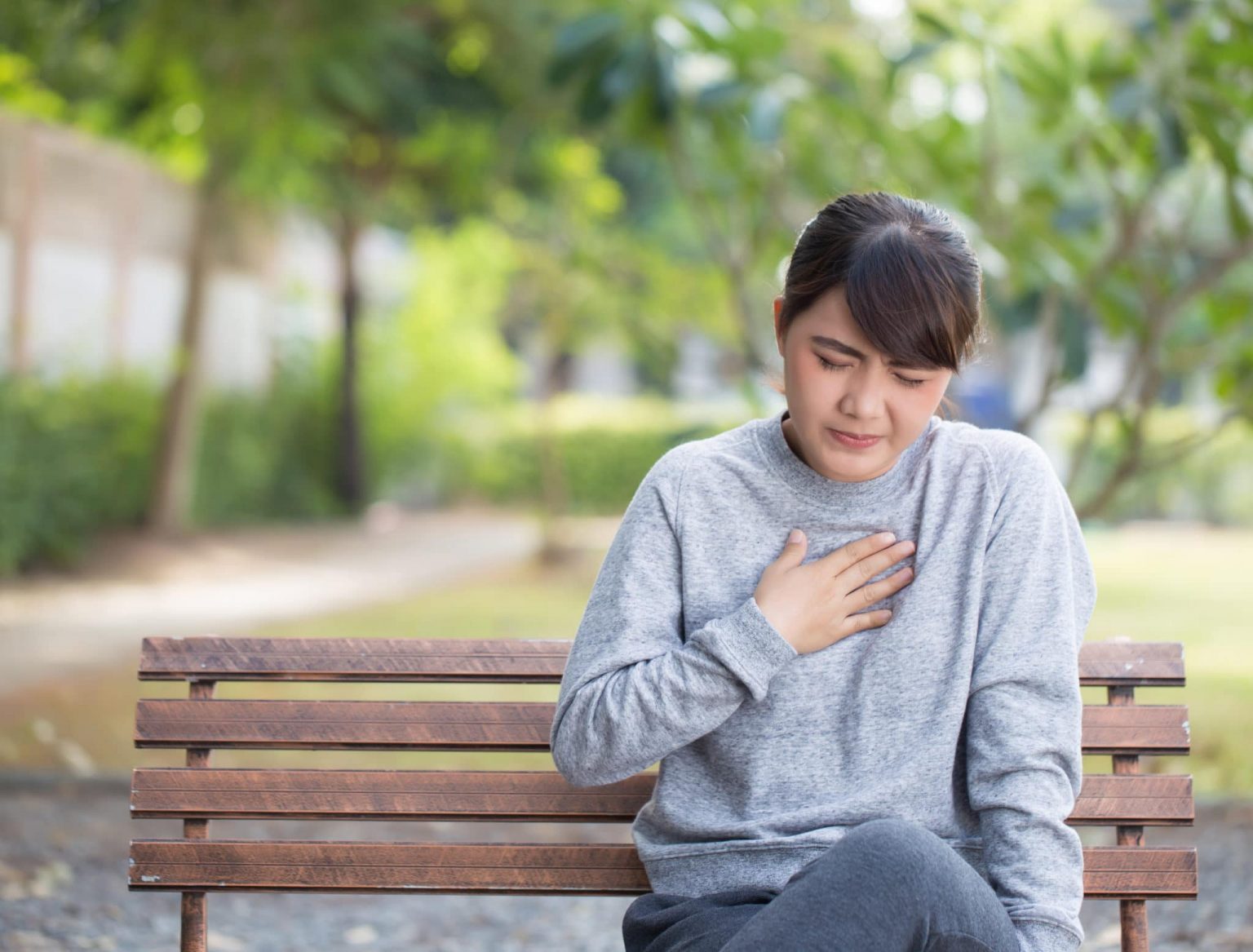 Woman suffering from gastroesophageal reflux disease