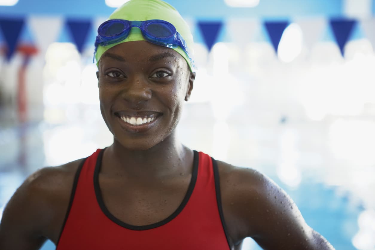 Smiling woman getting ready for a swim.