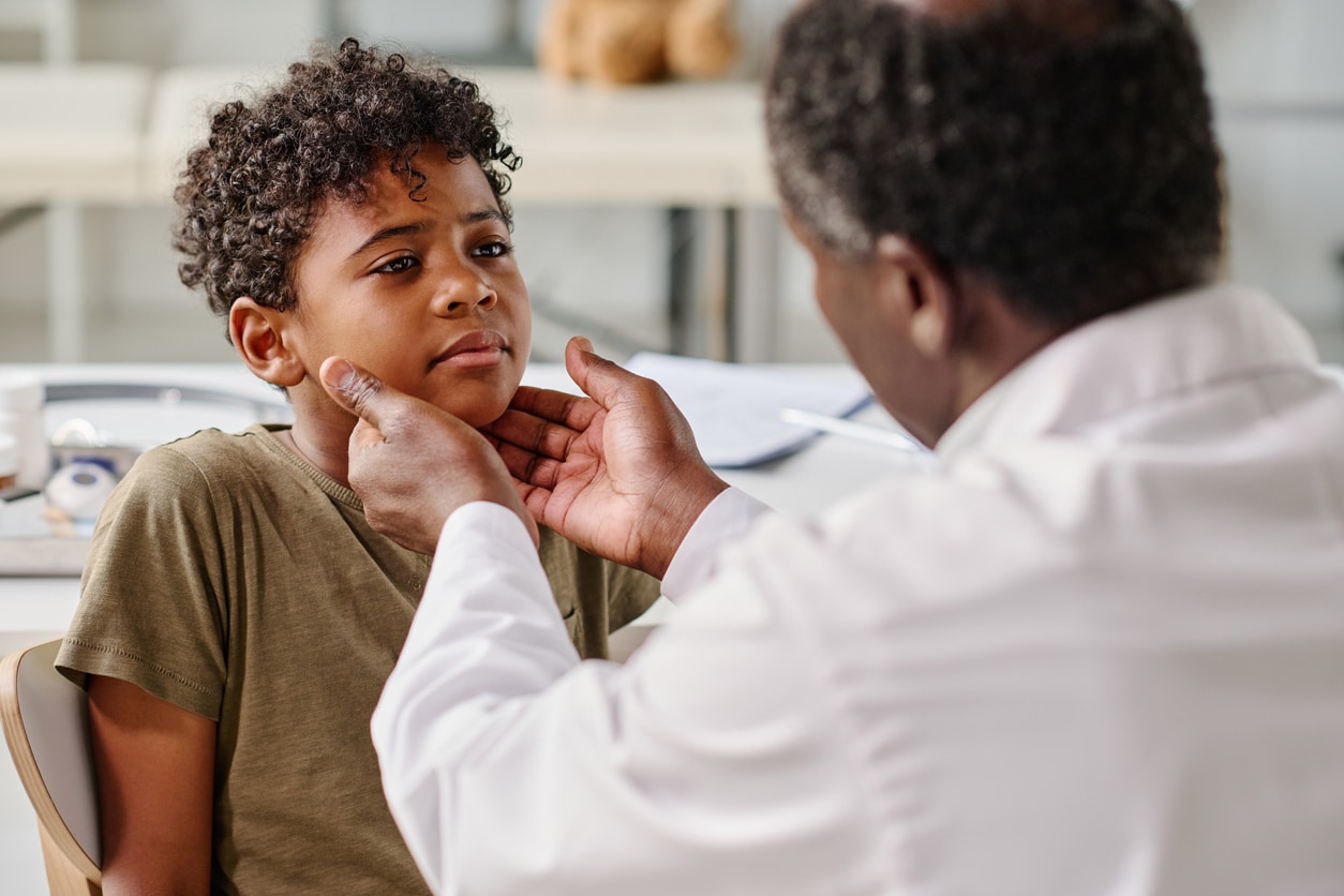 Young boy gets throat examined